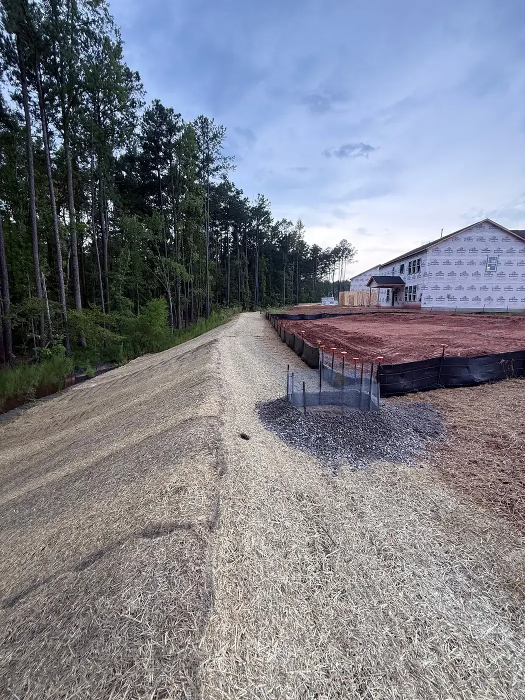 Erosion control matting installed on a graded slope by Delcid in North Carolina