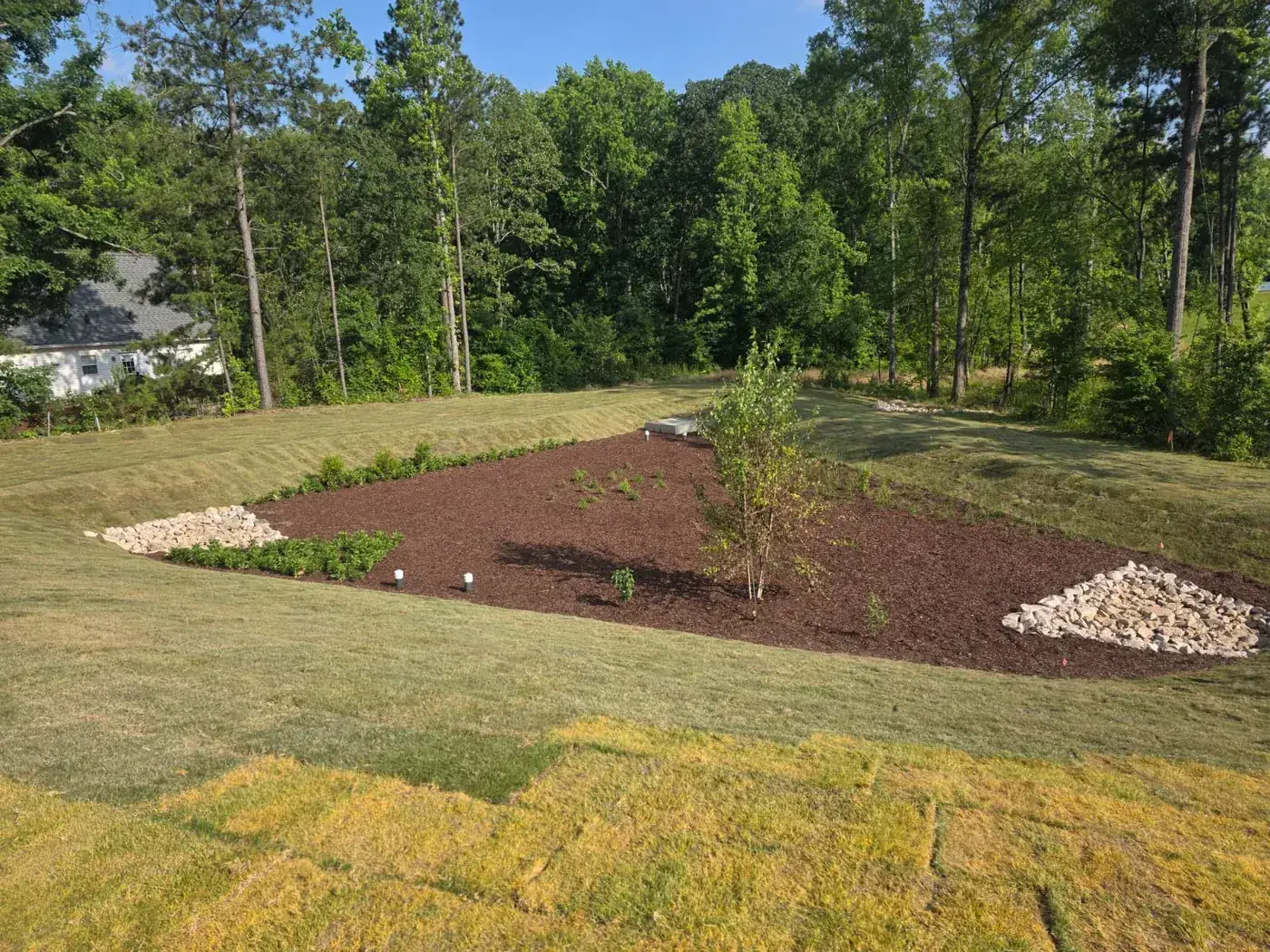 Finished basin with mulch beds and established sod
