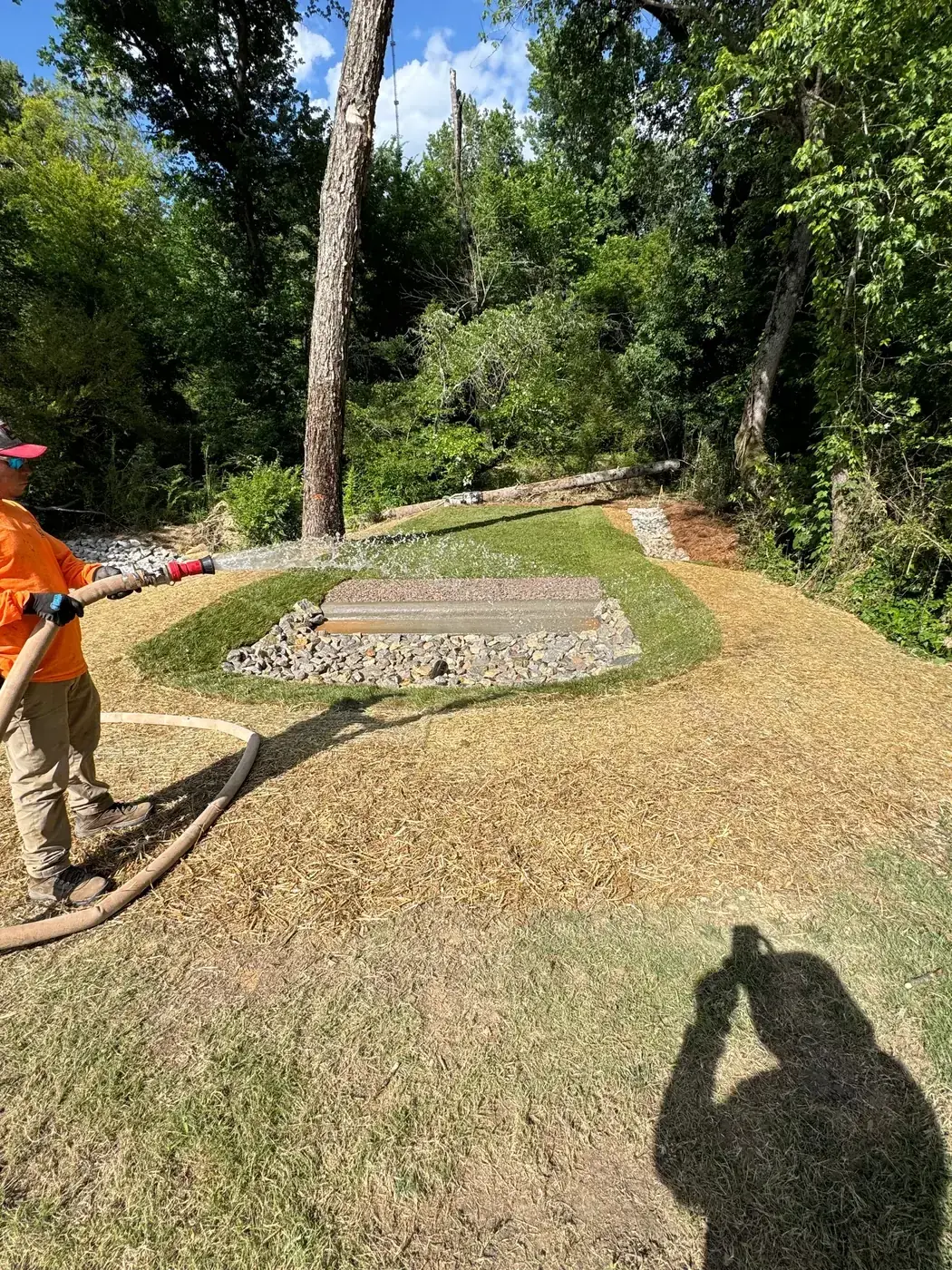 Delcid team member testing a finished level spreader structure