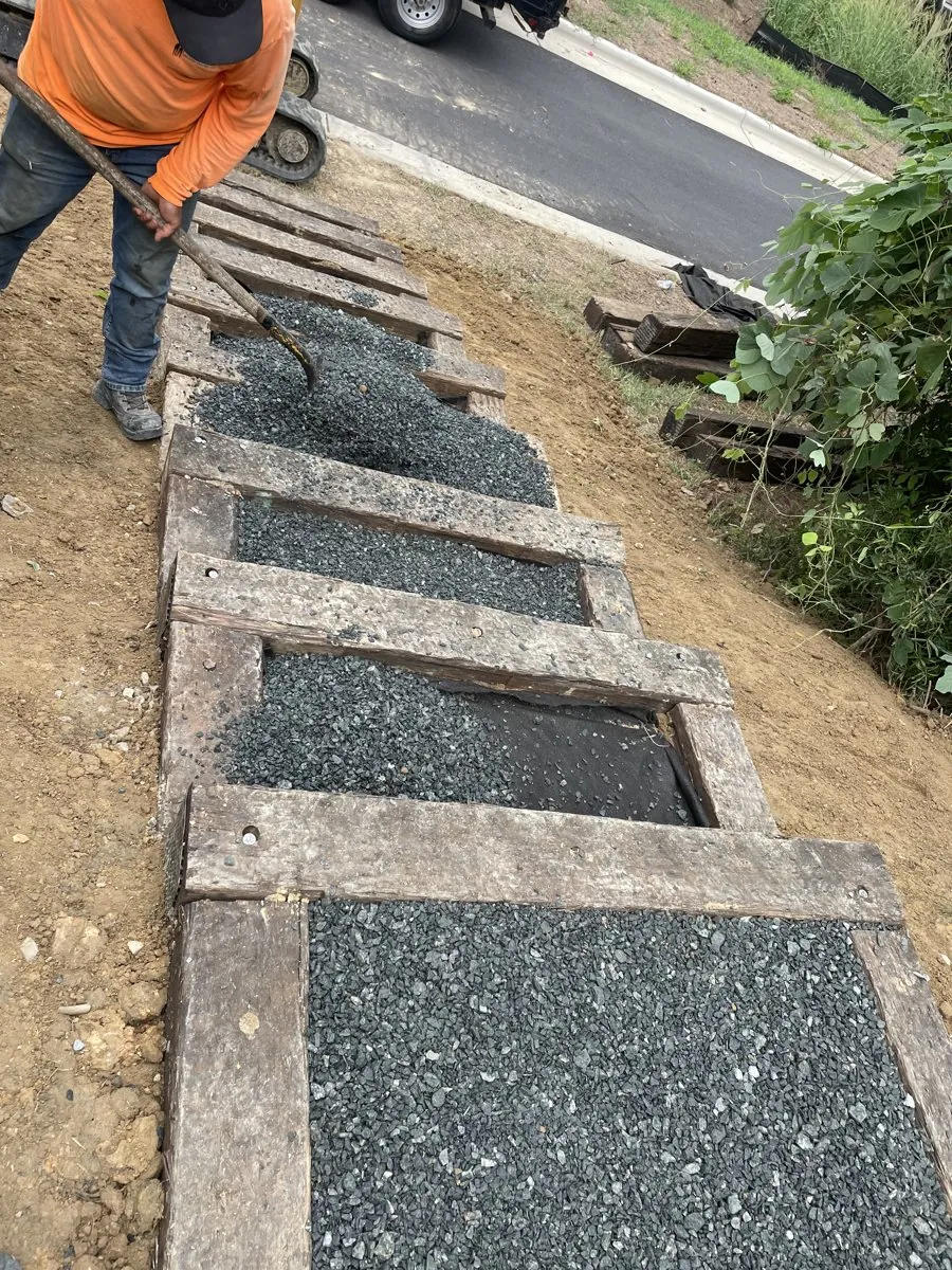 Crew finishing the community park staircase at Midtown Rows