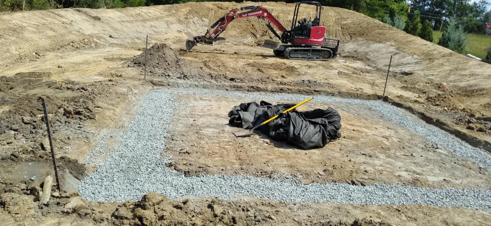Installing a stone pad at Midtown Rows