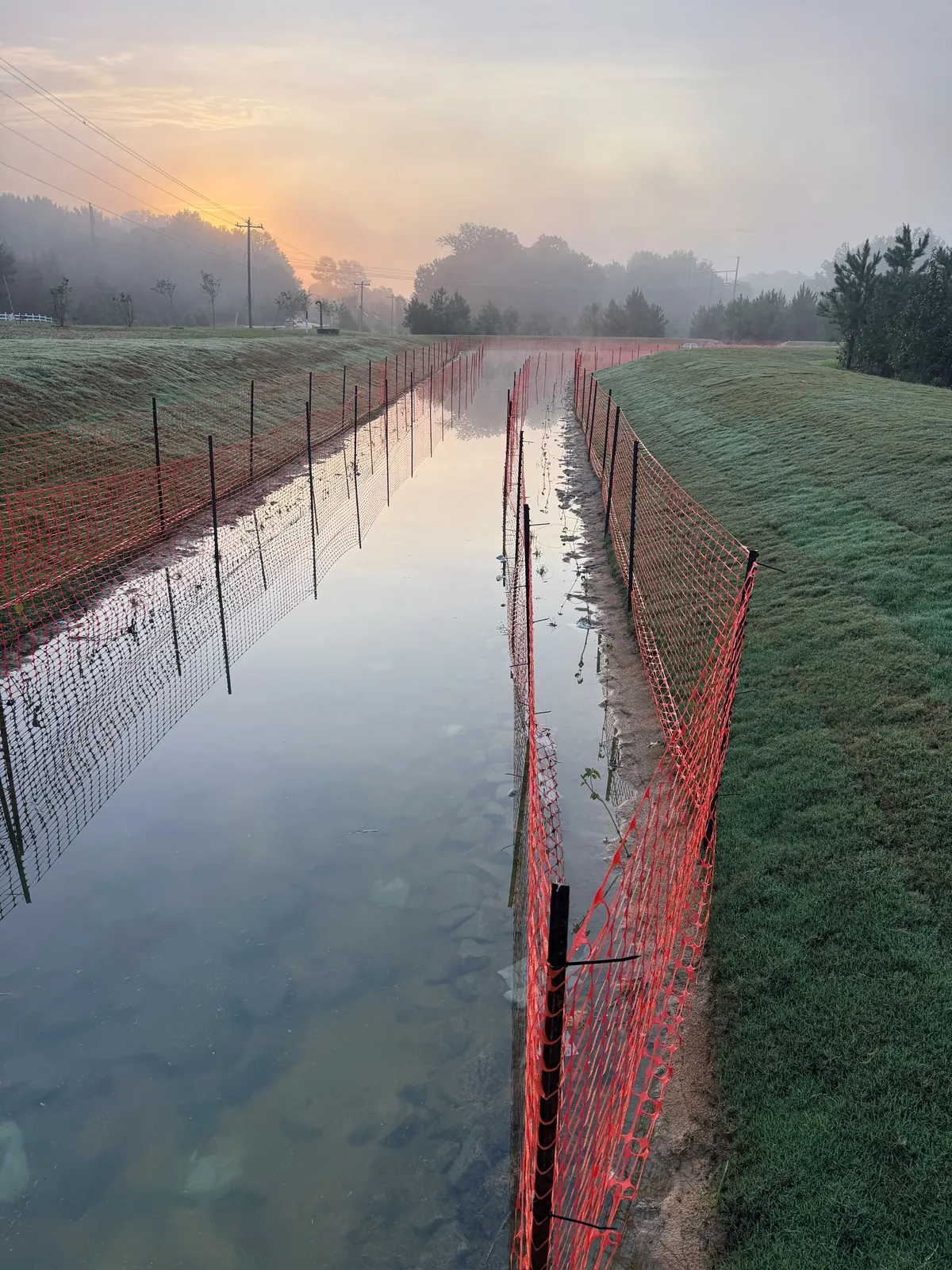 Stormwater channel at sunrise, Parc Townes at Wendell