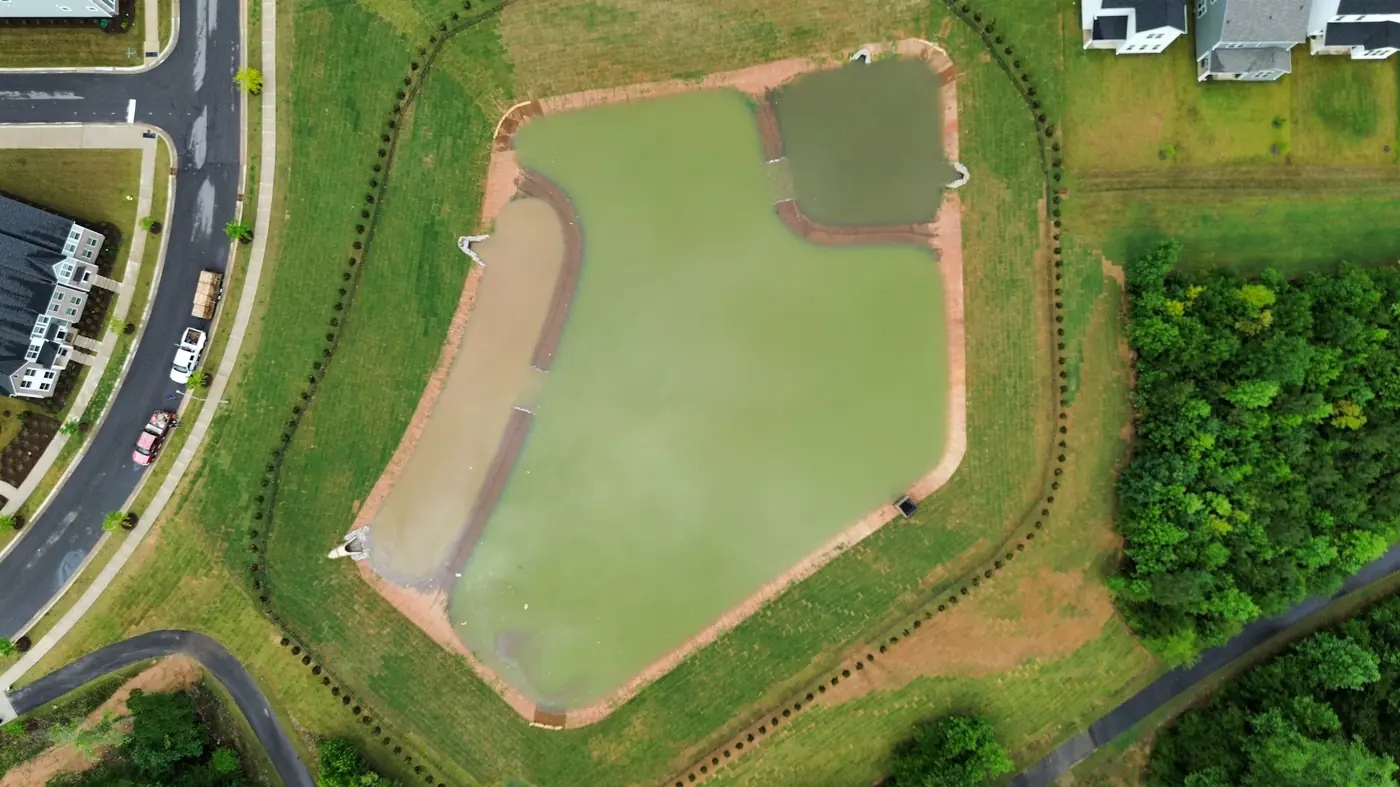 Aerial view of a completed stormwater pond system after Delcid's pond conversion work