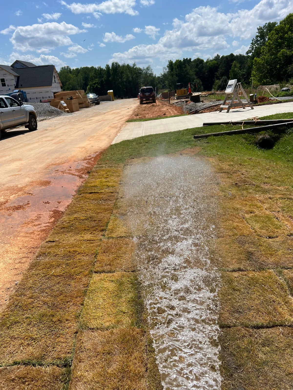 Watering freshly installed sod at Sauls Landing